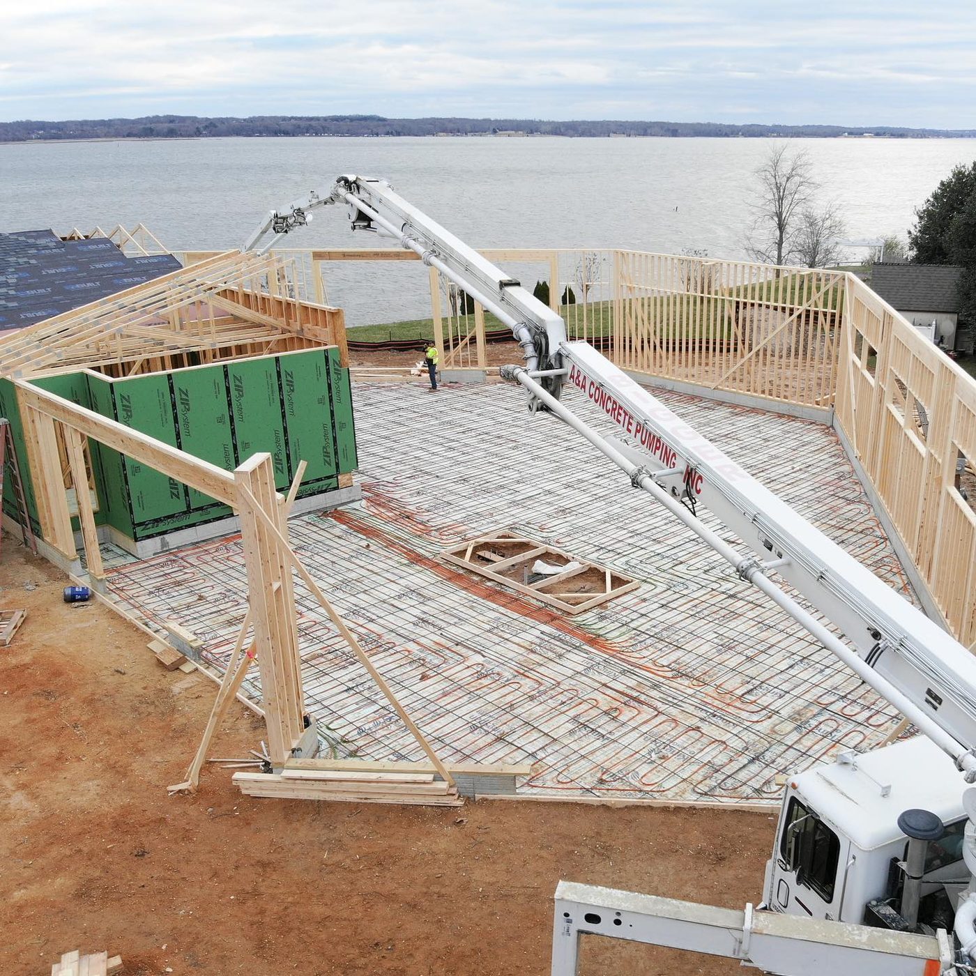 Commercial-grade radiant floor concrete pour with in-ground car lift by Shady Lane Construction in Southern Maryland