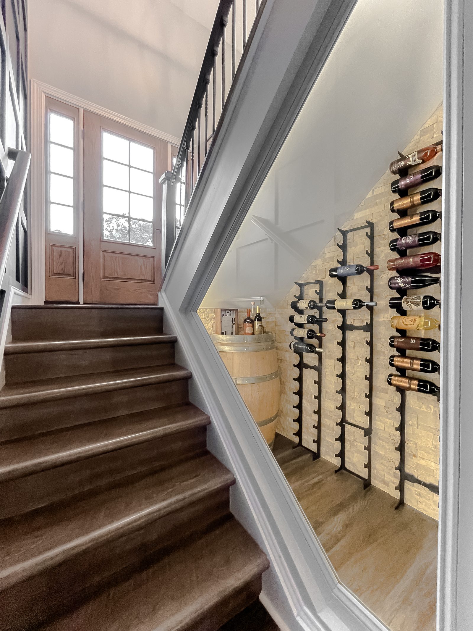 Wine display along the staircase at the Comanche Lane renovation